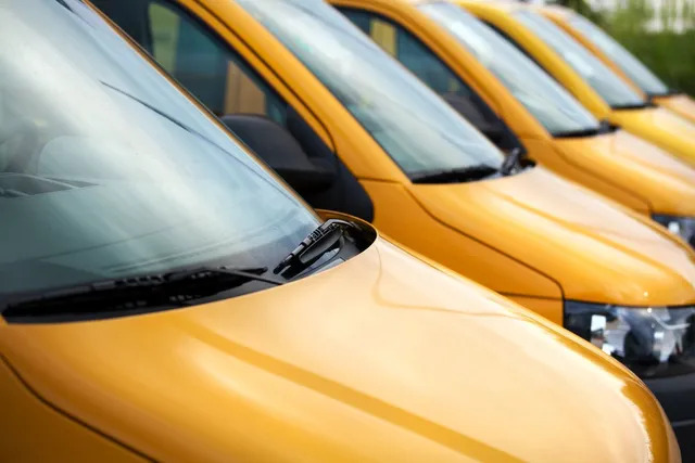 yellow fleet of vans